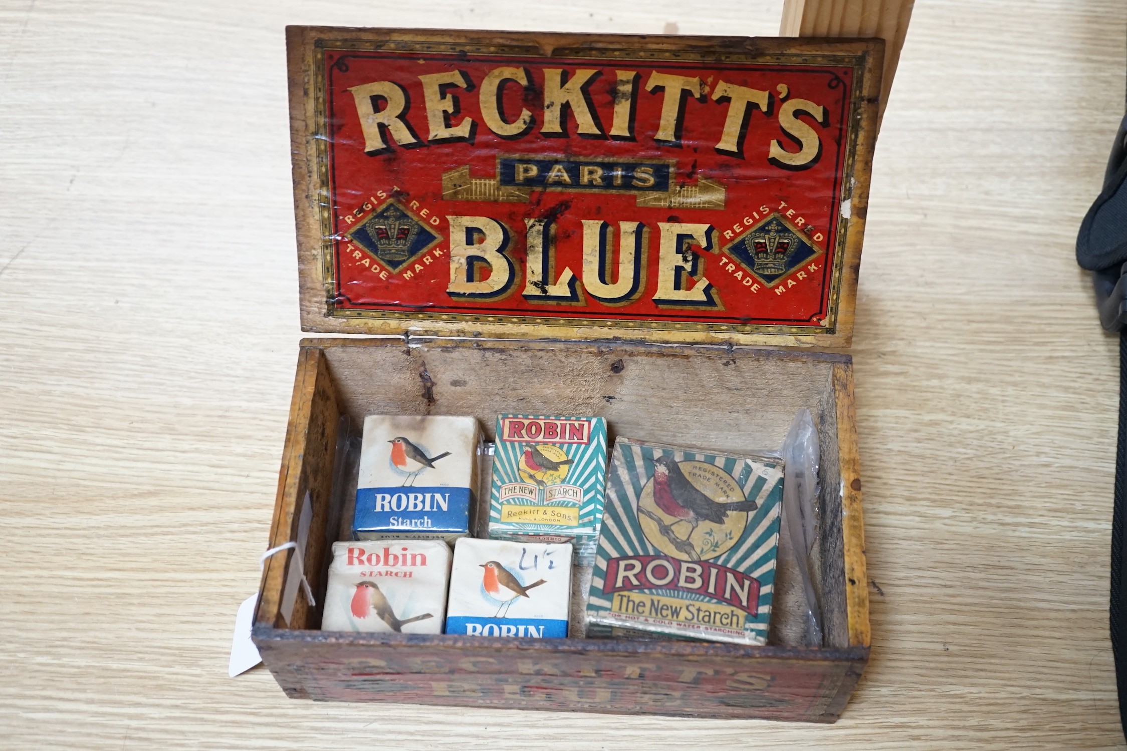 A Reckitt's Blue, Paris wooden box containing five unused packets of Robin’s Starch, box 24.5cms wide x 10cms high